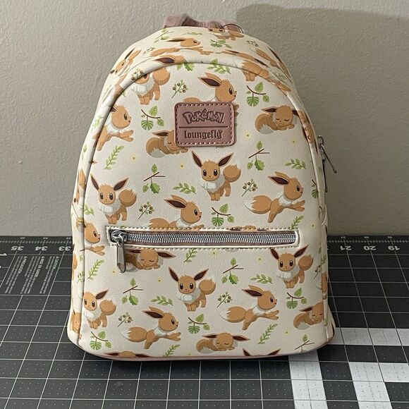 Loungefly Handbags - Eevee Pokémon Loungefly Mini Backpack NWT Purse Bag White Pink Strap